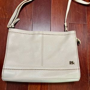 The Sak Cream Crossbody Bag with Flap Closure